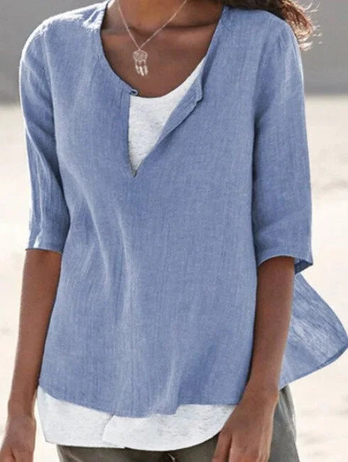 Blusa donna versatile scollo a V, maniche 3/4. Design elegante con orlo asimmetrico, per primavera/estate e ufficio.