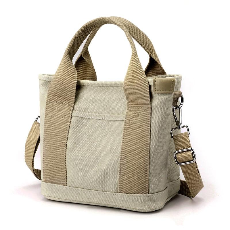 Borsa a tracolla piccola da donna in tela multicolore vivace, accessorio versatile e alla moda.