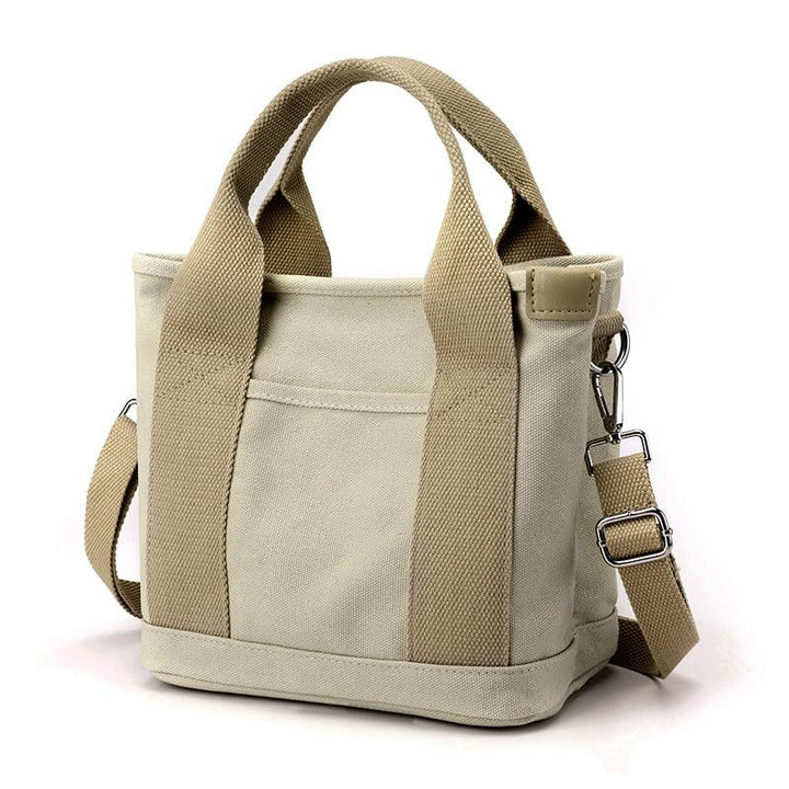 Borsa a tracolla piccola da donna in tela multicolore vivace, accessorio versatile e alla moda.