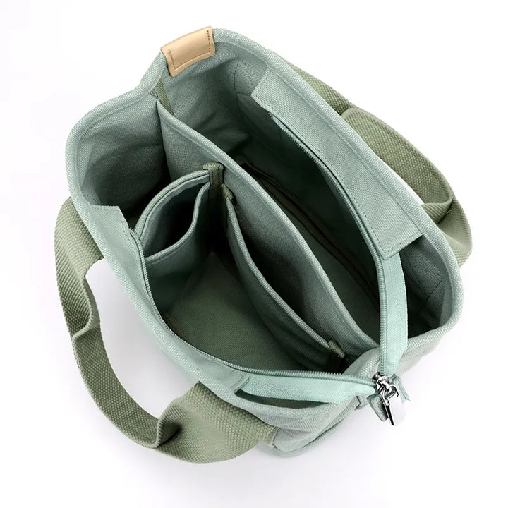 Elegante borsetta a tracolla da donna piccola in tela multicolore, ideale per viaggio o uso quotidiano.