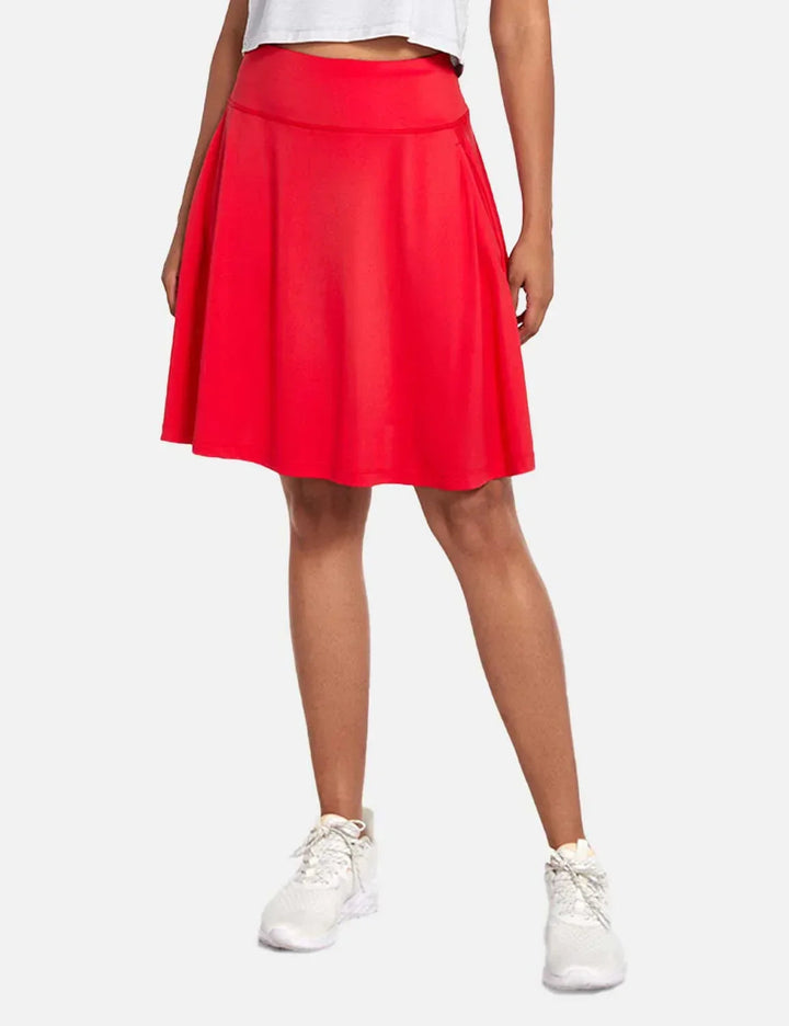 Gonna a pieghe donna con short interno, UPF50+, tasche e vita alta per un look estivo attivo.