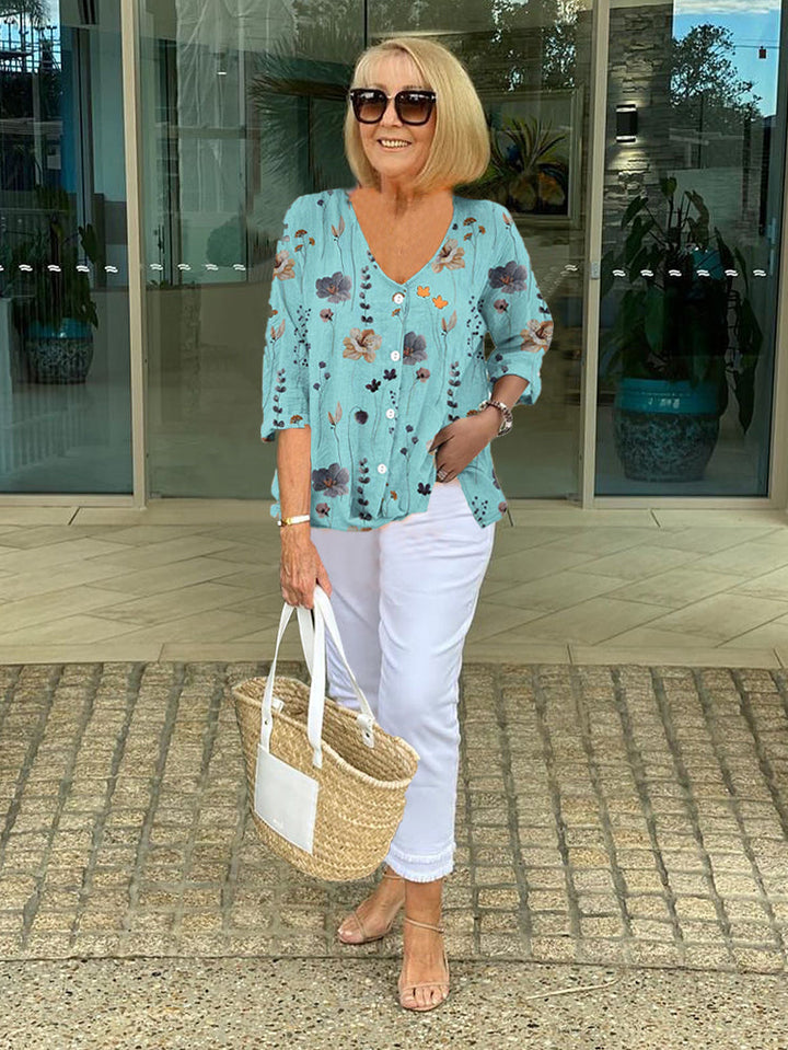 Blusa floreale da donna con scollo a V, perfetta per primavera/estate. Stile elegante e casual.