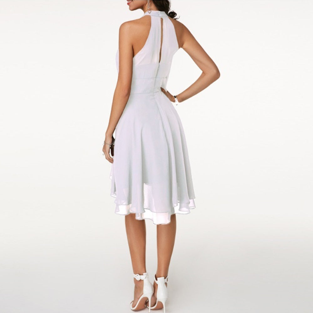 Mini abito elegante donna, scollo all'americana, volant, vita aderente. Perfetto per serate e cerimonia.