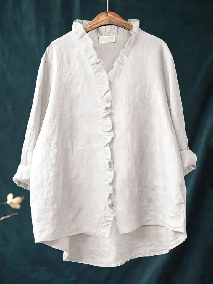 Top estivo donna oversize con scollo a V e maniche arrotolate, ideale per la moda femminile.