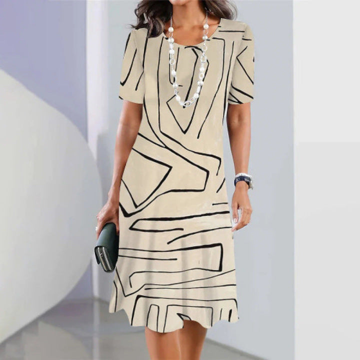 Abito trapezio donna in cotone con stampa geometrica moderna, elegante e comodo per la primavera.
