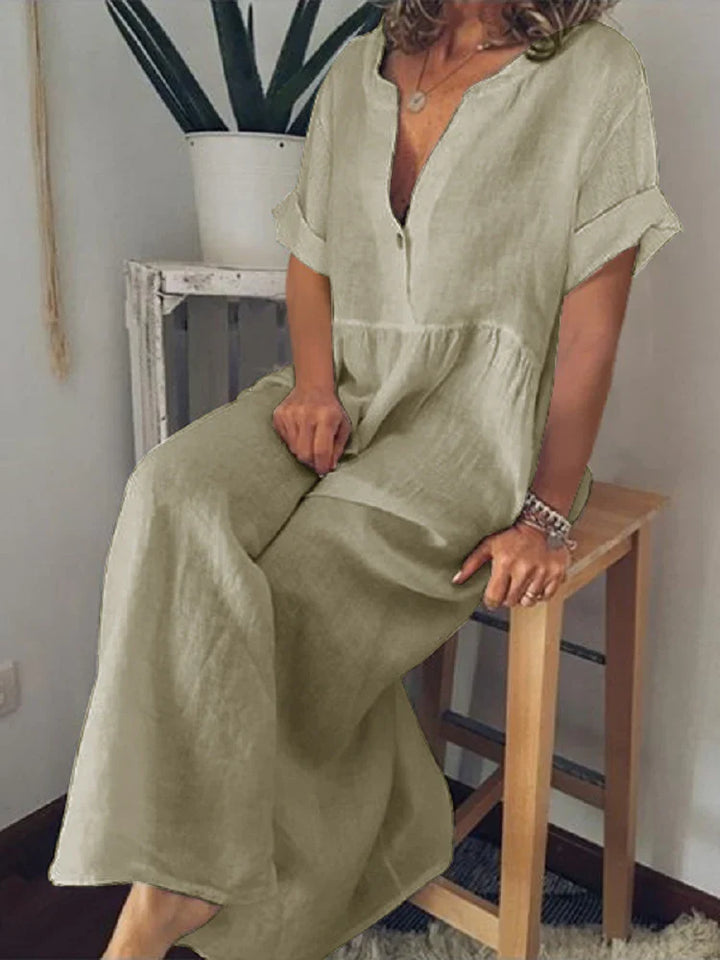 Vestito estivo lungo da donna, modello fluido con scollo a V e maniche corte arrotolate, per un comfort estivo.
