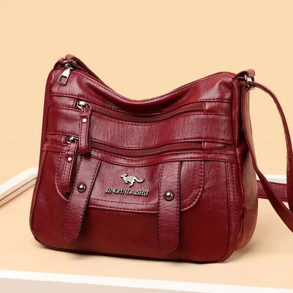 Accessorio donna: borsa a mano in pelle, rifiniture di pregio, stile italiano sofisticato.