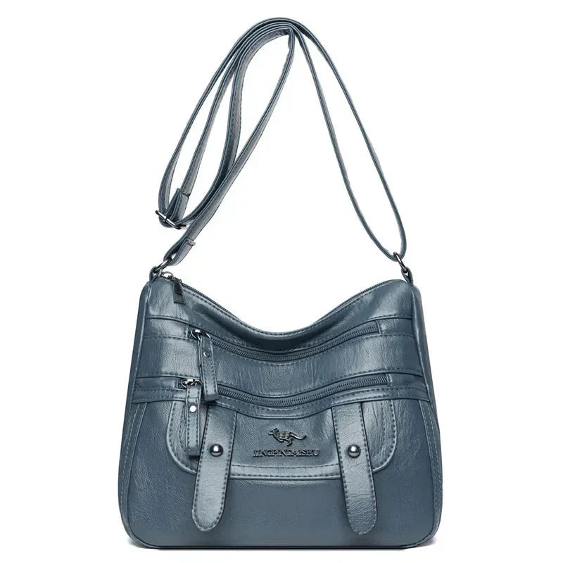 Modella con borsa a mano in pelle, accessorio che completa un outfit elegante e chic.