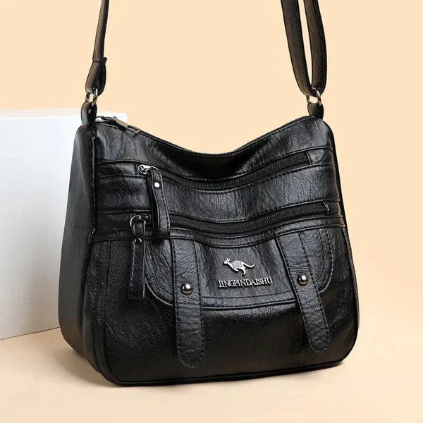 Borsa in pelle da donna, versatile e pratica, ideale come borsa a mano o a tracolla.