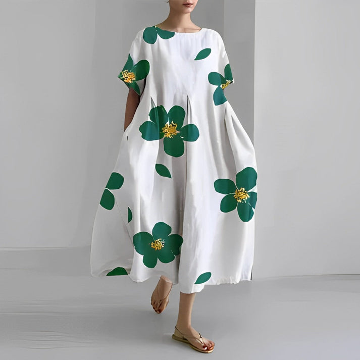 Elegante abito estivo da donna Zoe, maxi dress in tessuto leggero, ideale per l'outfit estivo chic.