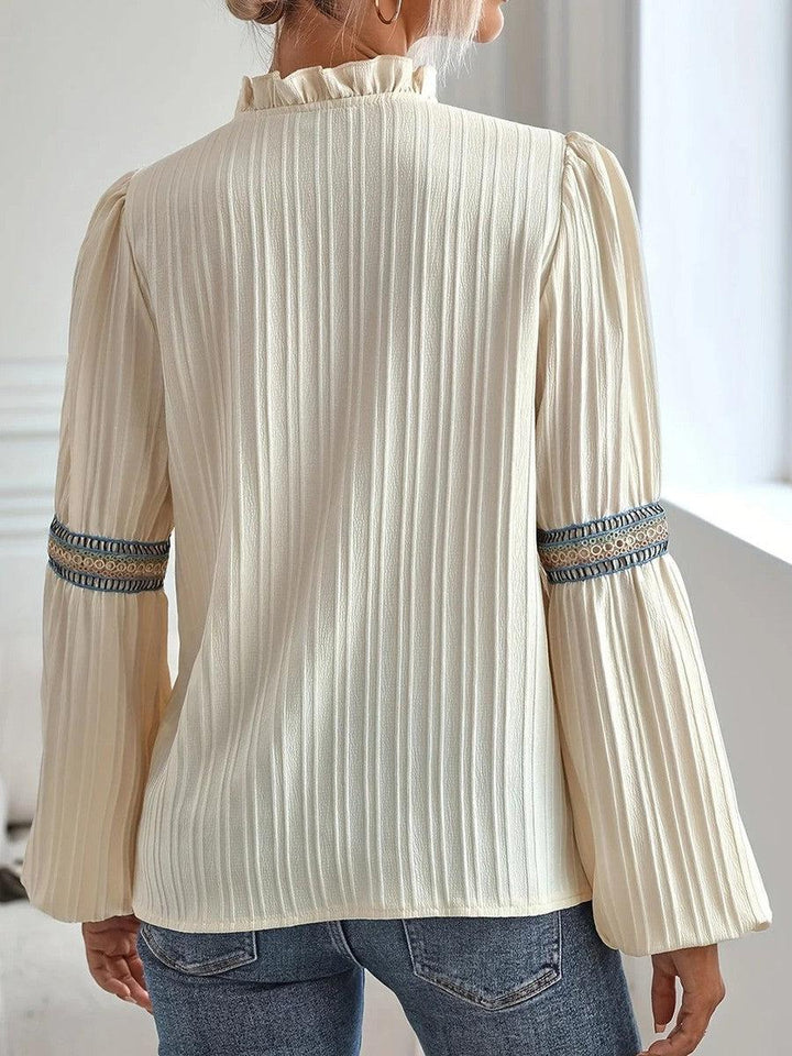 Camicetta donna elegante vintage con maniche lunghe, ideale per moda femminile e abbigliamento casual chic.