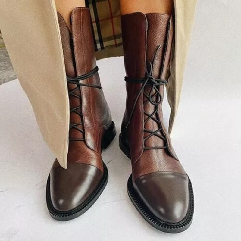 Stivaletti donna autunnali eleganti con tacco basso e finitura liscia, perfetti per look casual chic.