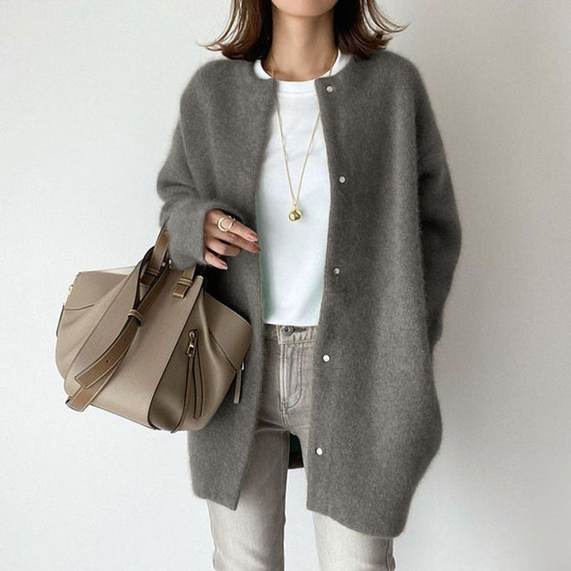 Cardigan donna lungo autunnale con pannelli effetto scamosciato, elegante e comodo per stratificazione.