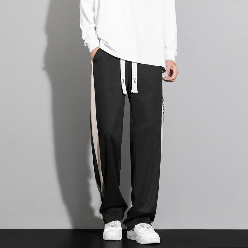 Pantaloni da uomo a righe, comodi e alla moda, con taglio a gamba dritta per un abbigliamento maschile versatile.