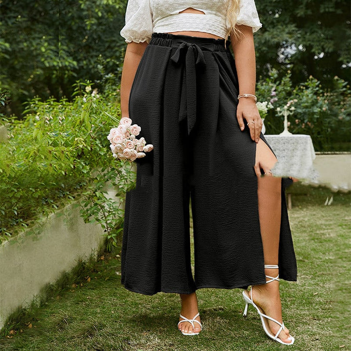 Pantaloni donna vita alta a gamba larga, stile cropped con fibbia. Ideali per outfit eleganti e casual.