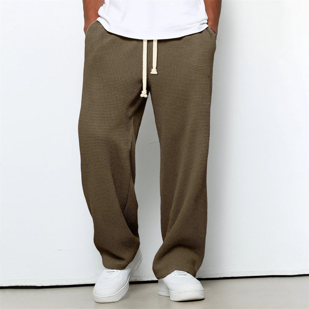 Pantaloni uomo casual sportivi, vestibilità ampia a gamba dritta. Perfetti per viaggio e tempo libero.