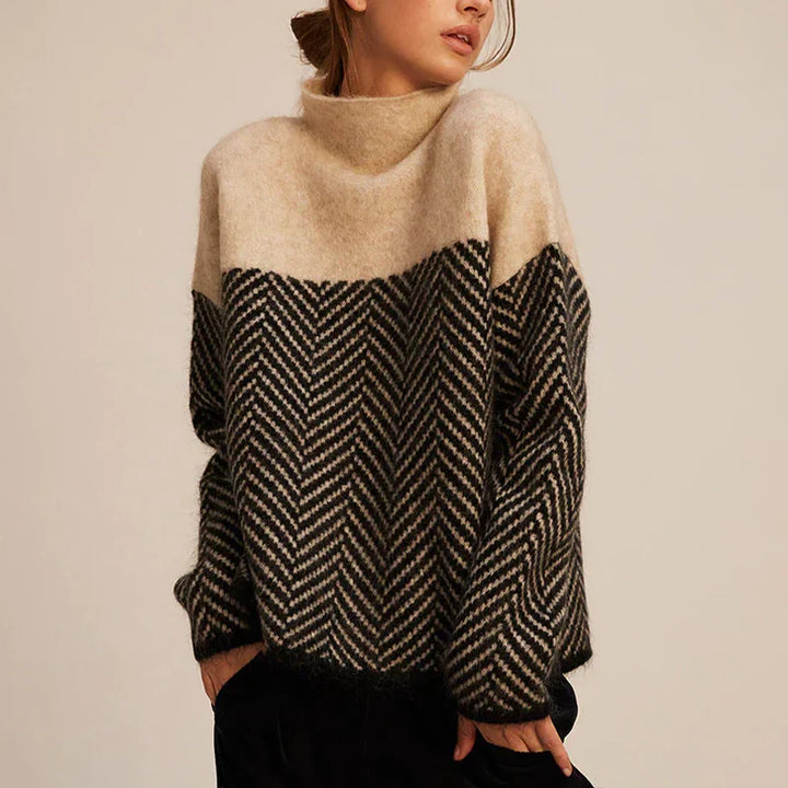 Pullover elegante da donna a collo alto, motivo spina di pesce, perfetto per un inverno caldo e chic.