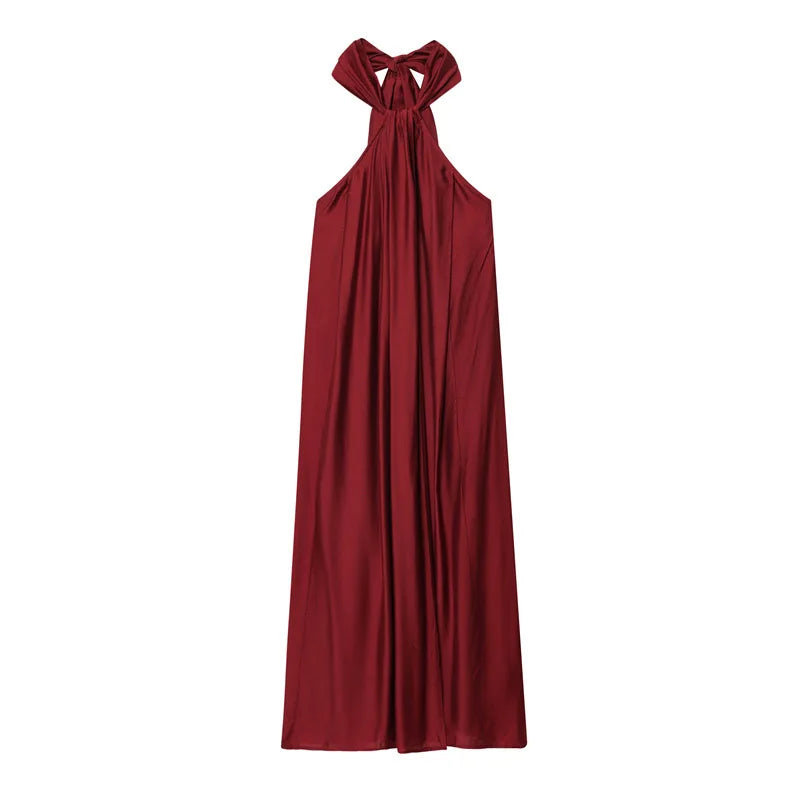 Abito bordeaux da donna con scollo halter, drappeggiato, stile fluido. Ideale per serate estive ed eventi.
