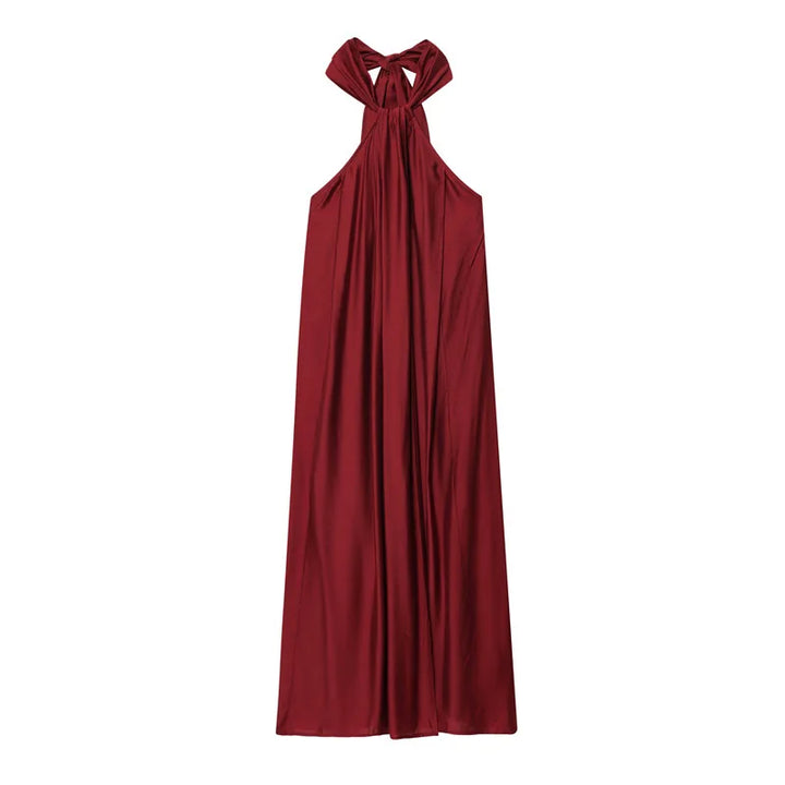 Abito bordeaux da donna con scollo halter, drappeggiato, stile fluido. Ideale per serate estive ed eventi.