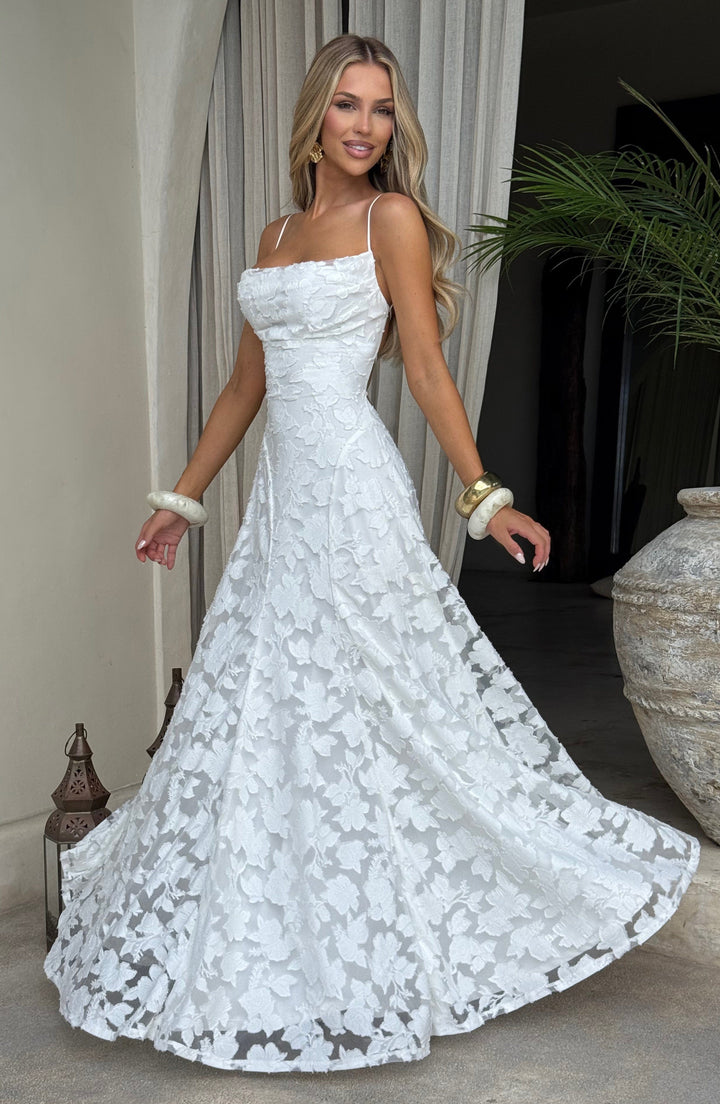 Abito donna elegante, maxi floreale, scollo drappeggiato e seducente dettaglio laccio posteriore.