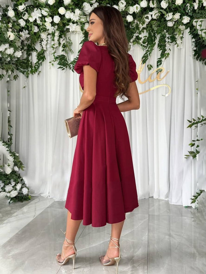 Vestito midi elegante da donna, con maniche a sbuffo e gonna svasata, per un look da cerimonia.