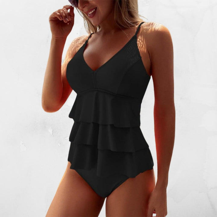Elegante tankini donna a due pezzi con top a volant e scollo a V, ottimo per l'estate in piscina.