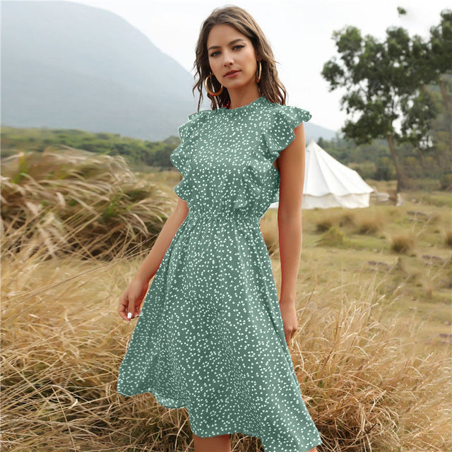 Elegante abito lungo donna a pois, con scollo a V e gonna ampia a linea A. Ideale per l'estate.
