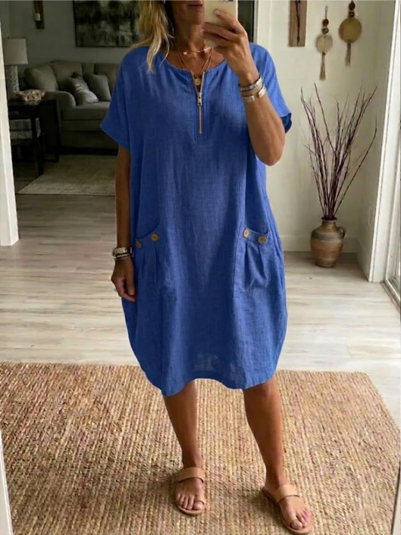 Vestito midi casual donna con zip frontale, maniche corte e tasche. Ideale per comfort quotidiano.