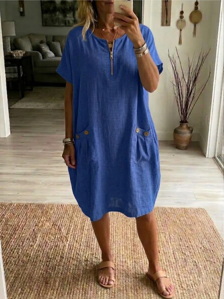 Vestito midi casual donna con zip frontale, maniche corte e tasche. Ideale per comfort quotidiano.
