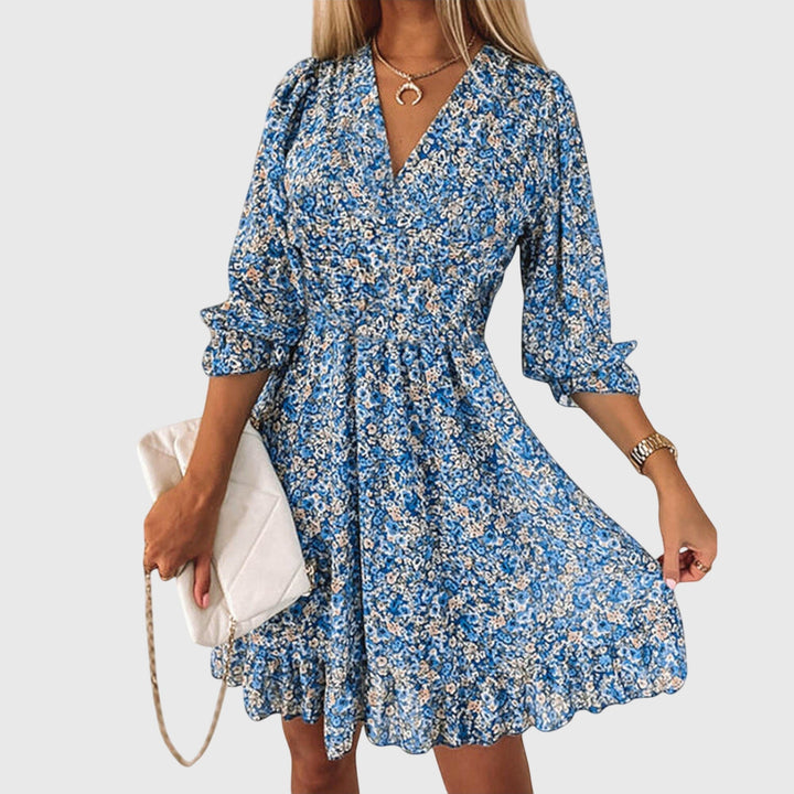 Abito floreale estivo donna midi con maniche a sbuffo e scollo a V, perfetto per vacanze.