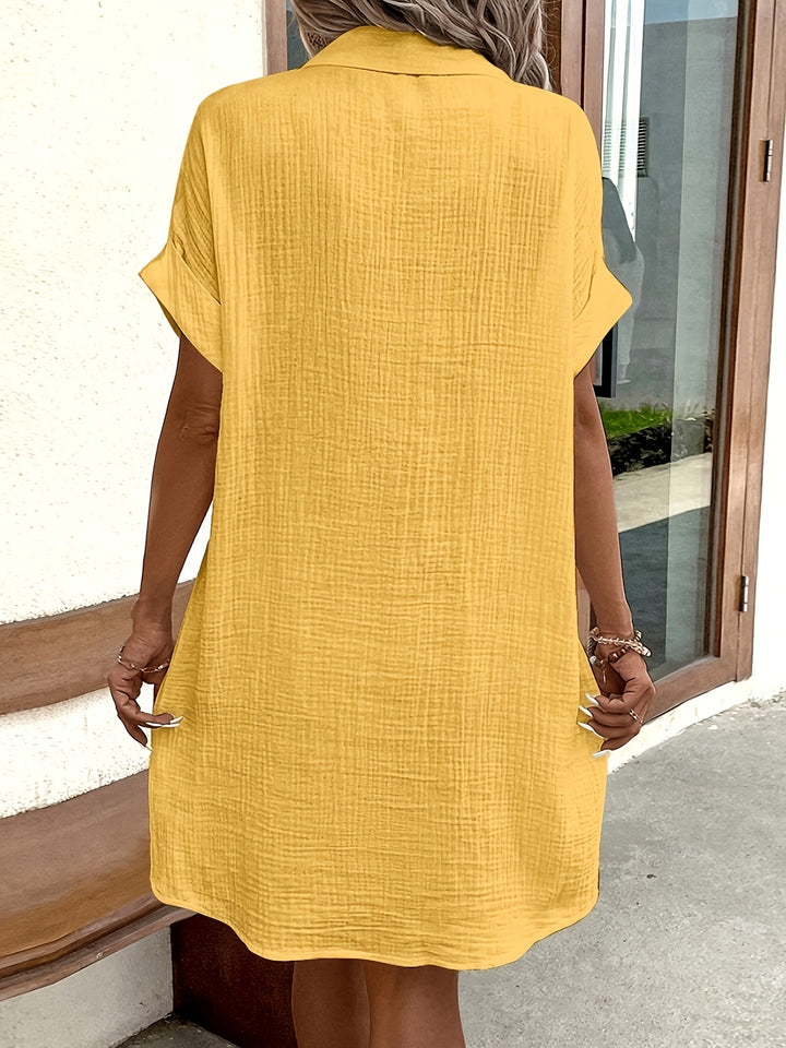 Abito camicia donna alla moda, midi versatile con bottoni e colletto, per un look casual-elegante.
