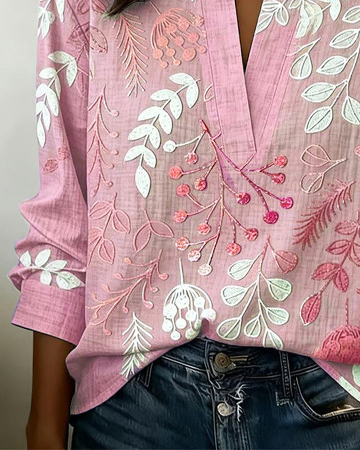 Blusa donna scollo a V e maniche tre quarti, fantasia floreale. Perfetta per eventi casual o serate estive.