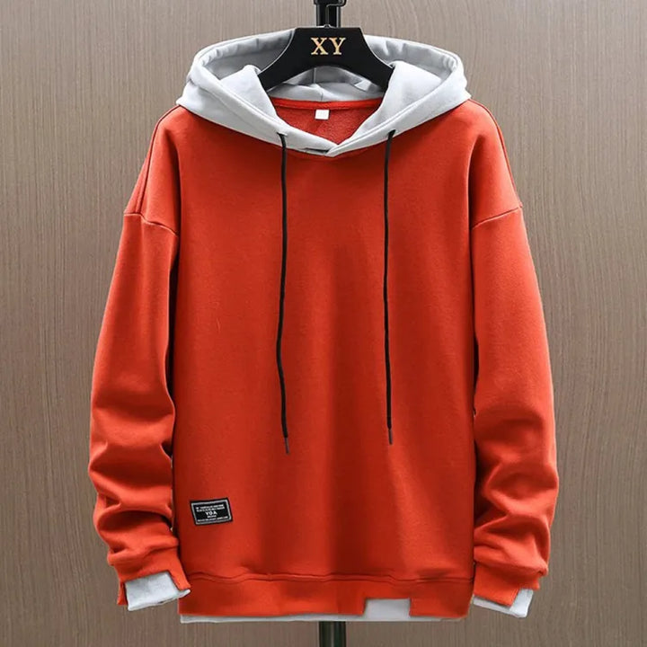Pullover felpa con cappuccio da uomo in tessuto morbido, offre comfort e stile per ogni occasione casual.