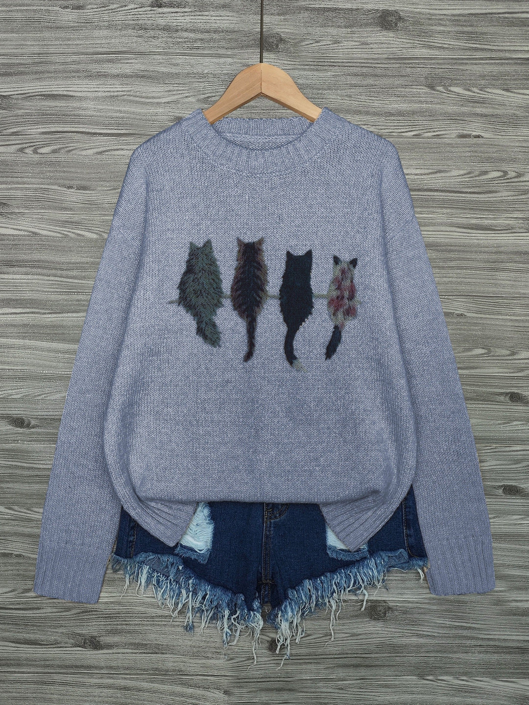 Maglione oversize donna albicocca con gatti, girocollo. Stile casual e comfort invernale.