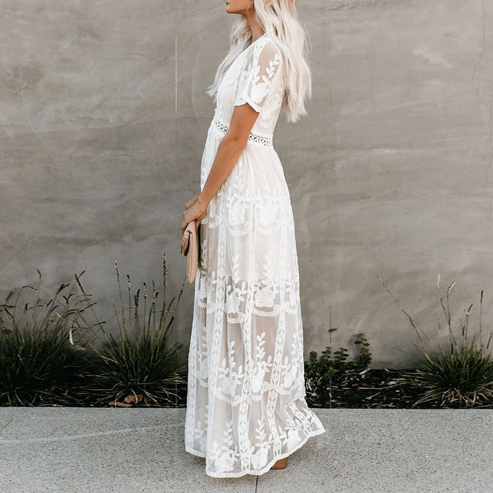 Abito maxi donna con collo a V e maniche corte, stile casual chic fluttuante, ideale per il comfort estivo.