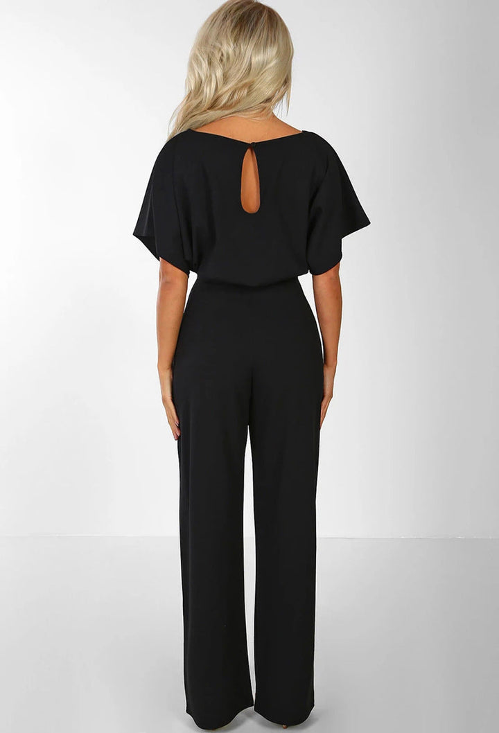 Tuta intera donna con vita alta che valorizza la figura, abbigliamento versatile per ogni occasione.