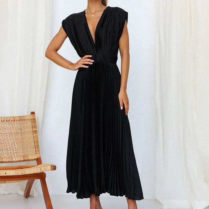 Elegante abito da sera lungo plissettato con scollo a V, ideale per cerimonie e eventi formali femminili.