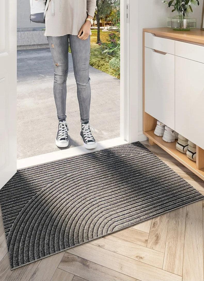 Tappeto zerbino antiscivolo grigio, ideale per interni, protegge il pavimento dall'umidità e dallo sporco.