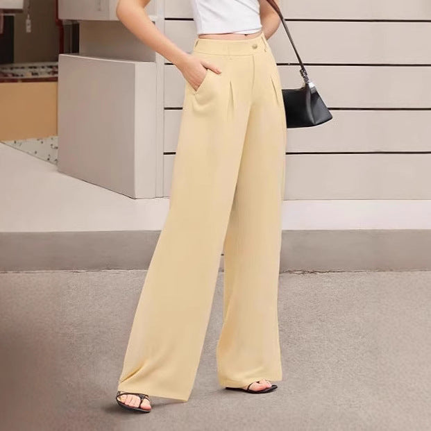 Pantaloni donna a vita alta con gamba ampia per outfit casual o da ufficio. Moda primavera versatile.