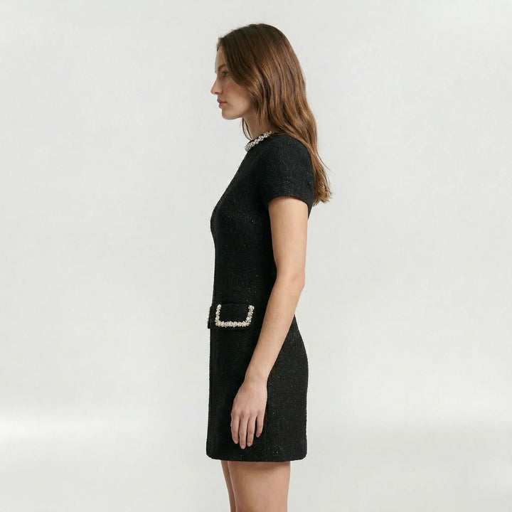 Vestito da donna nero, mini abito elegante con perle e tasche finte. Ottimo per cocktail, serate e occasioni.