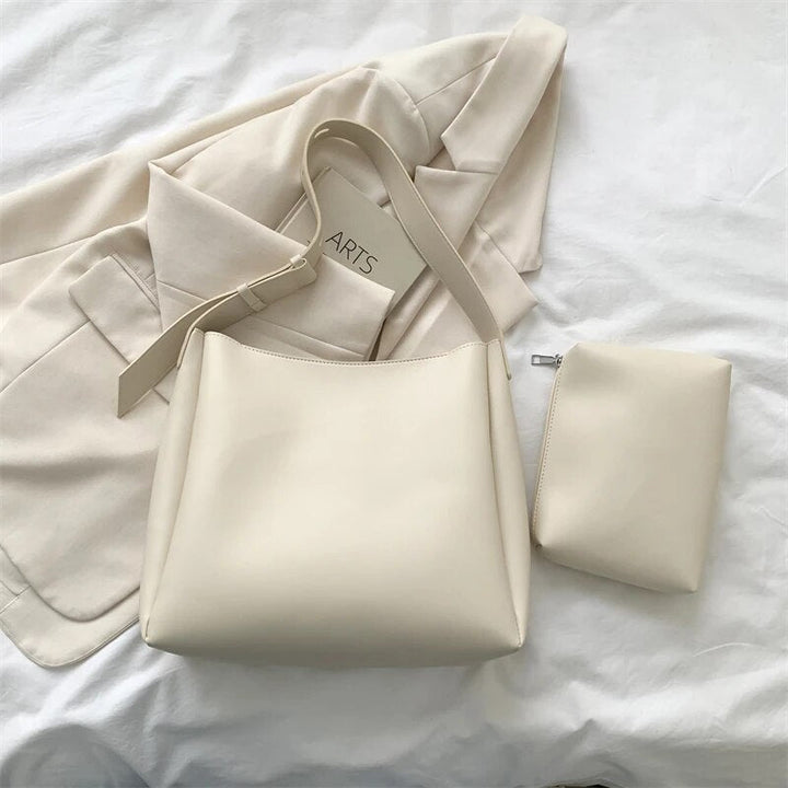 Borsa a tracolla minimalista unisex, design pulito e funzionale per accessori quotidiani.