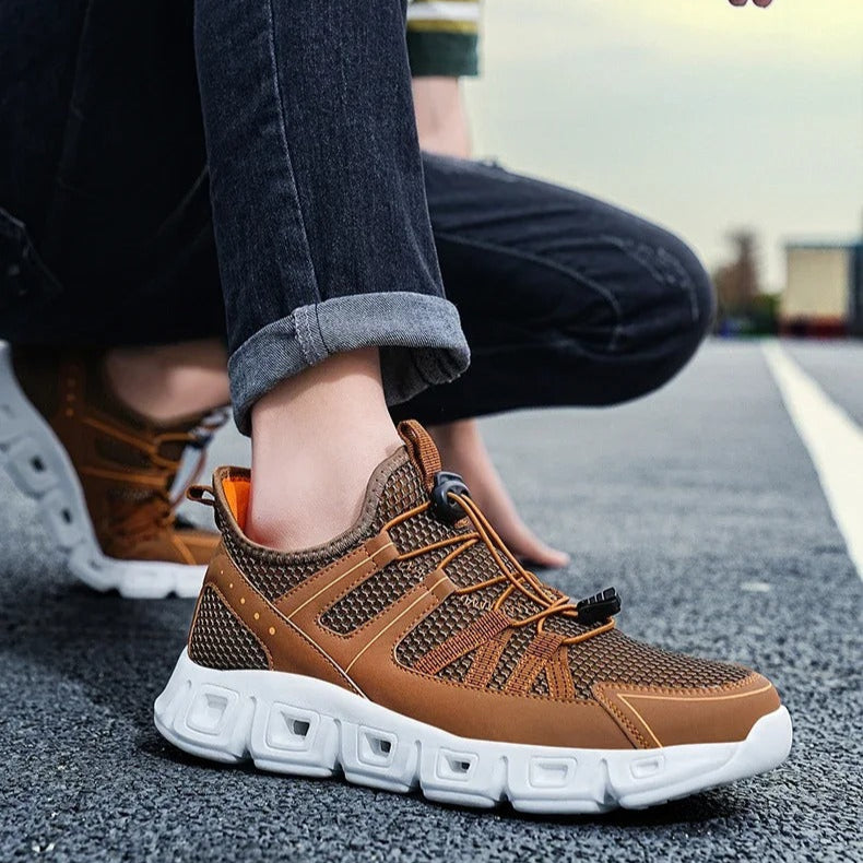 Scarpe sportive uomo leggere e ammortizzate per corsa, garantiscono comfort e performance.