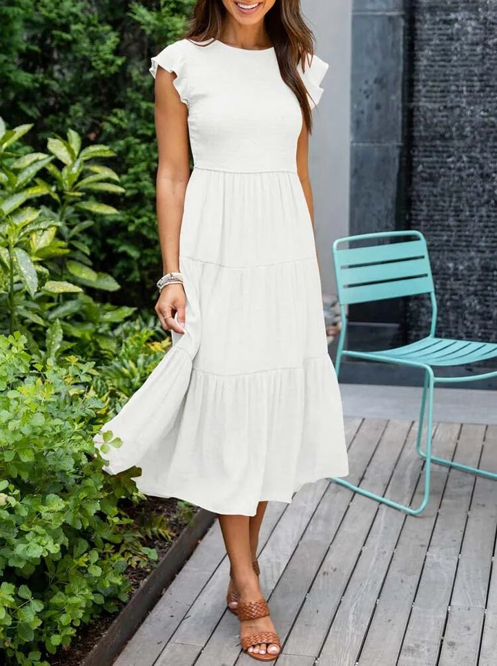 Abito midi estivo elegante da donna con maniche a farfalla, perfetto per la primavera e l'estate.