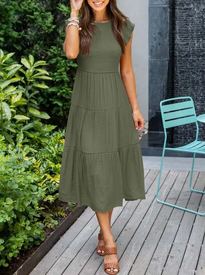 Abito verde midi estivo da donna con maniche a farfalla, perfetto per occasioni casual o eleganti.