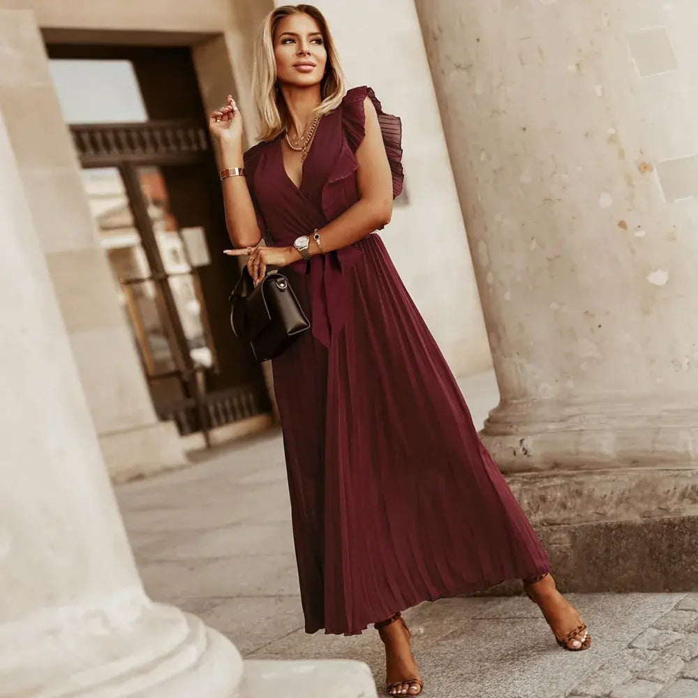 Abito estivo donna scollo a V, senza maniche e volant, perfetto per giorni caldi e serate.