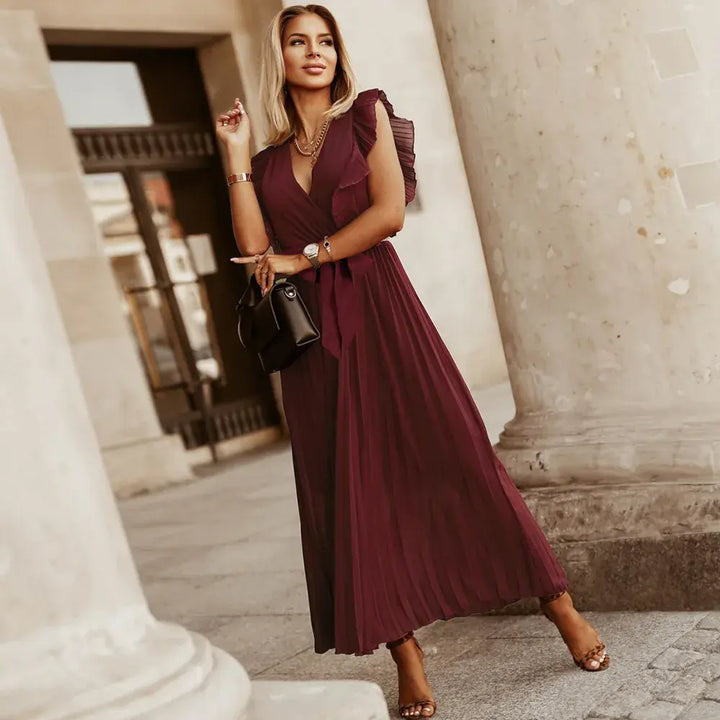 Abito estivo donna scollo a V, senza maniche e volant, perfetto per giorni caldi e serate.