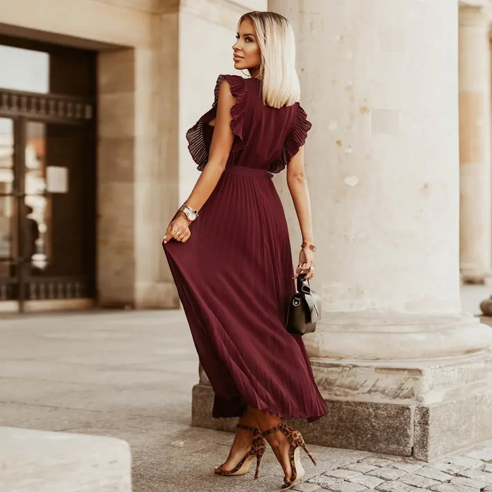 Abito lungo donna versatile, scollo a V, volant e senza maniche. Perfetto elegante o casual.