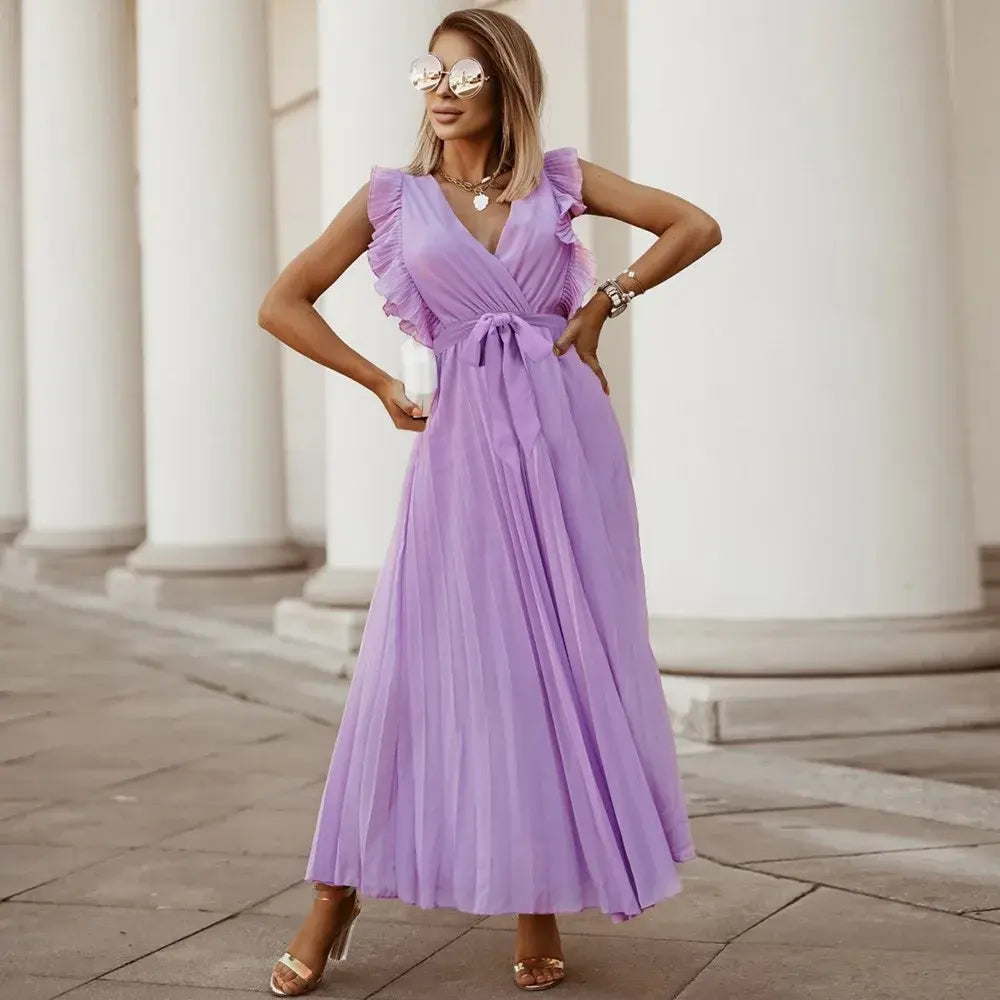 Abito lungo donna completo, scollo a V e volant. Stile boho-chic per l'estate vacanziera.