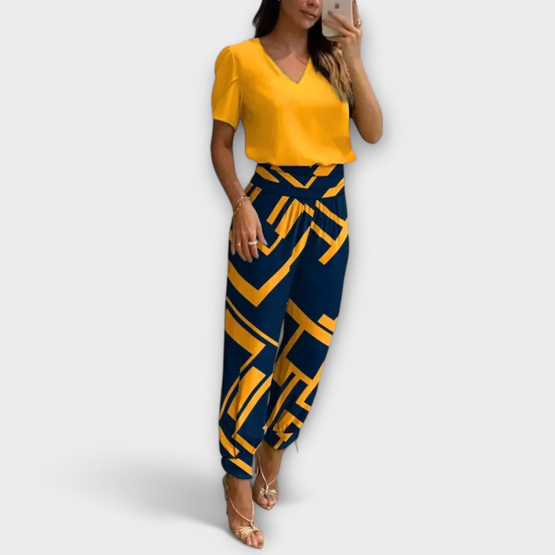Top elegante e pantaloni ampi fluidi per un completo donna set due pezzi. Abbigliamento versatile e raffinato.