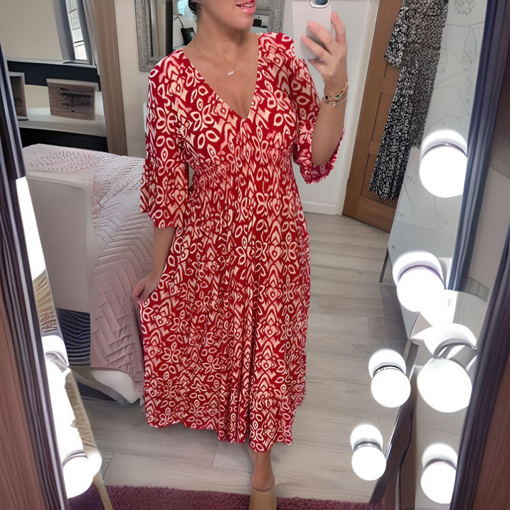 Moda donna: abito boho estivo, lungo e fluido con scollo a V, stampa grafica. Ideale per taglie forti.